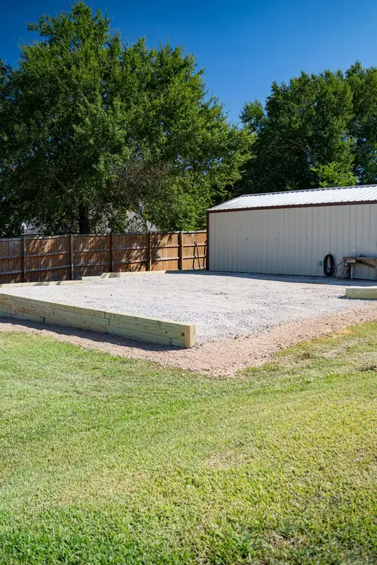 Finished boat and RV pad with timber wall and gravel, White Oak, TX
